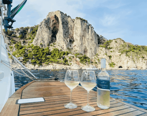 sitemgr bottle of wine and glasses on yacht